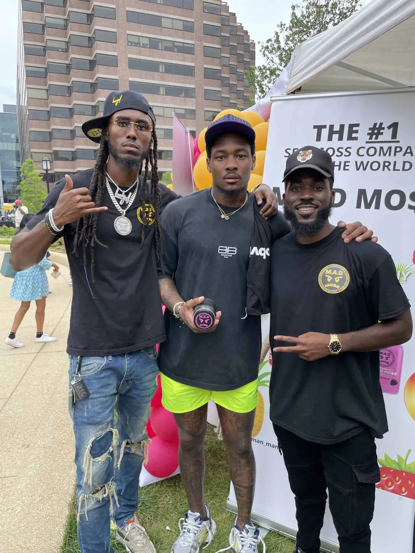 The M.A.D MOSS crew at a community event tent