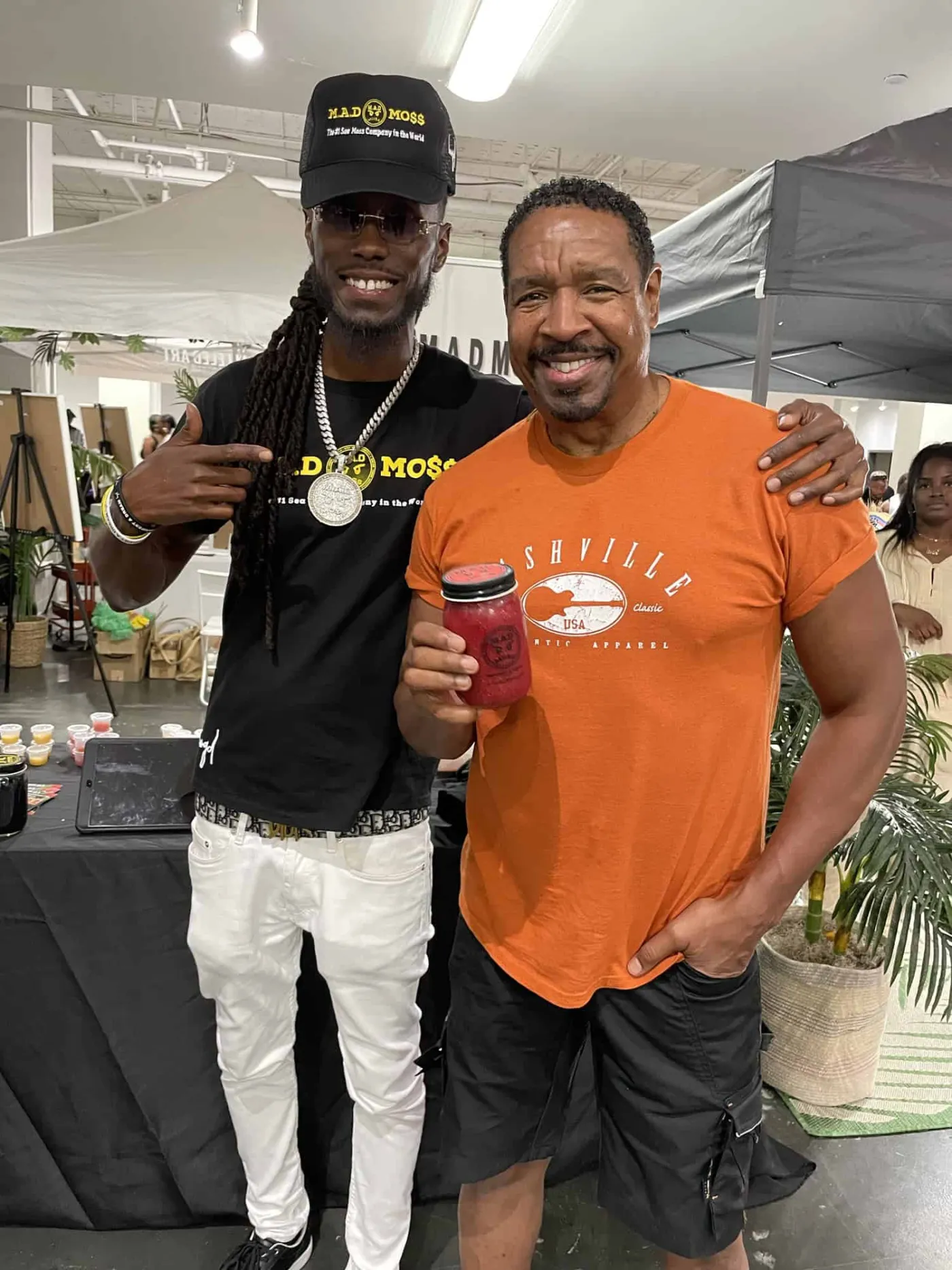 The founder and a happy M.A.D MOSS customer with a jar