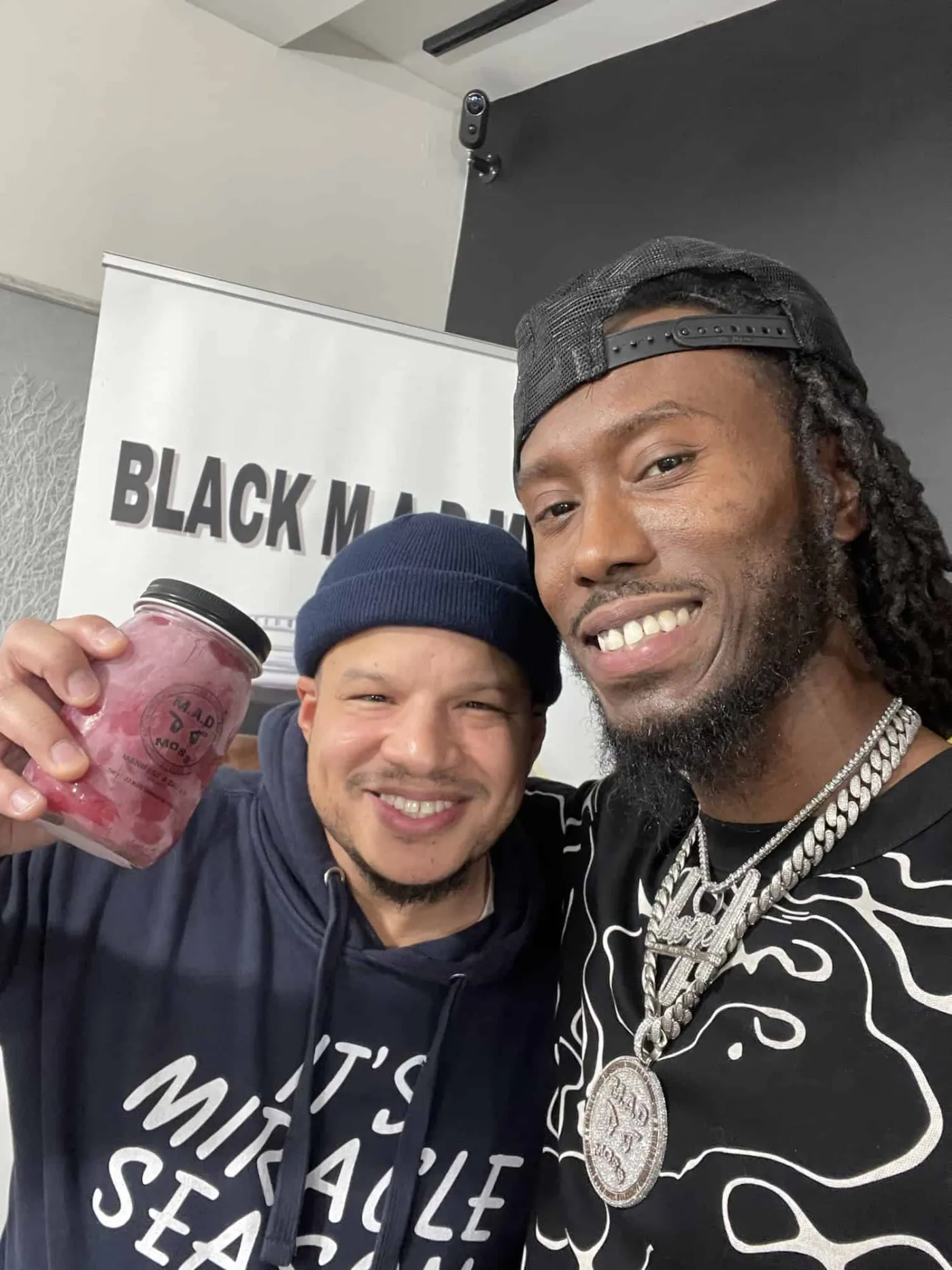 A customer and the M.A.D MOSS founder at a pop-up event