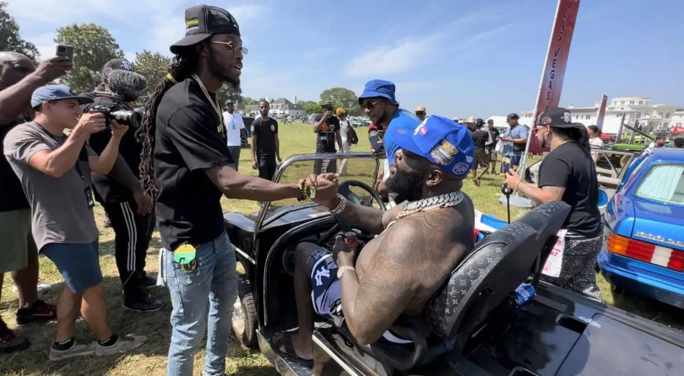 The founder greeting the community at an outdoor event